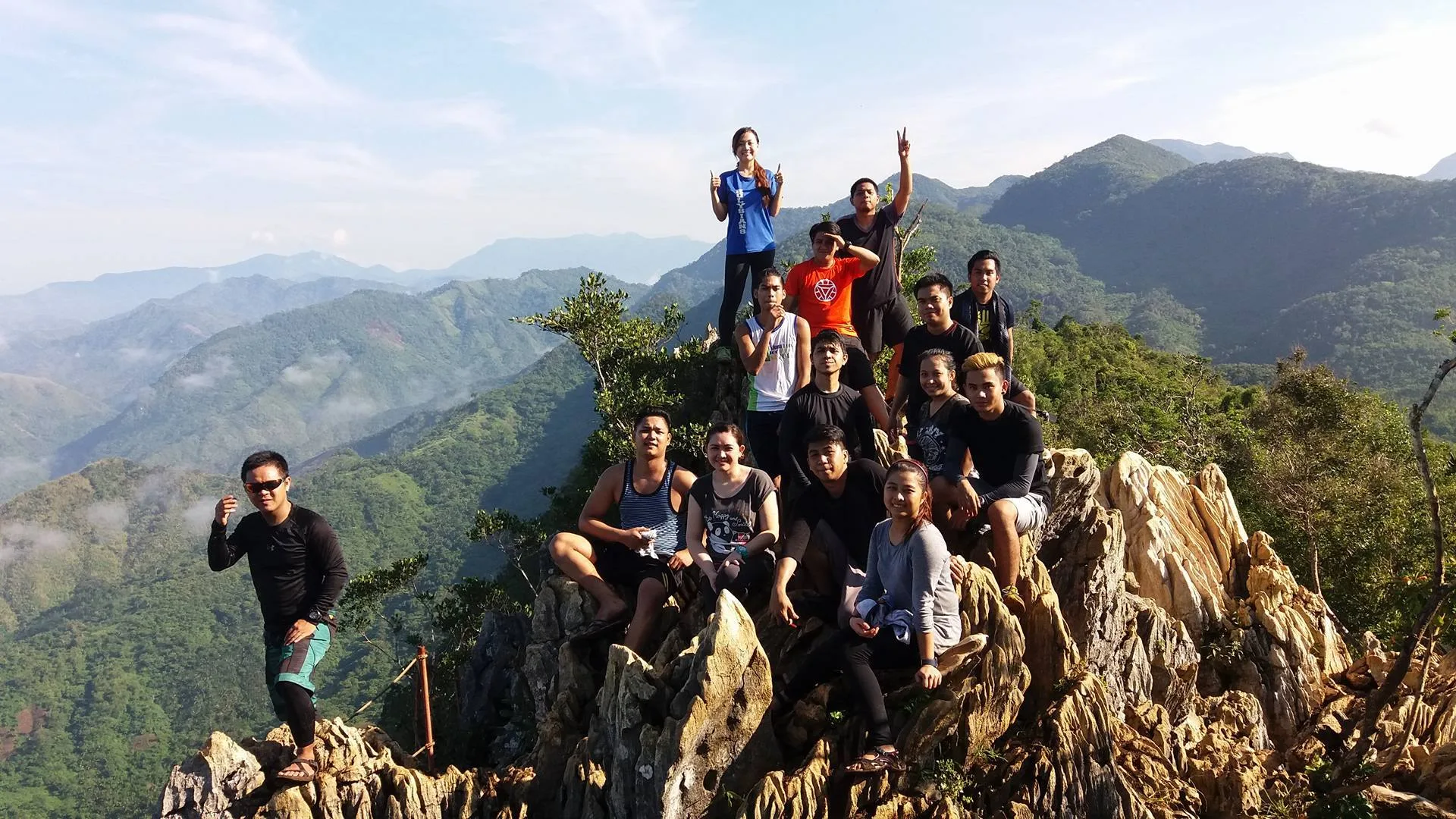 Hikers resting at a flat clearing campsite on Mt. Daraitan near the summit area