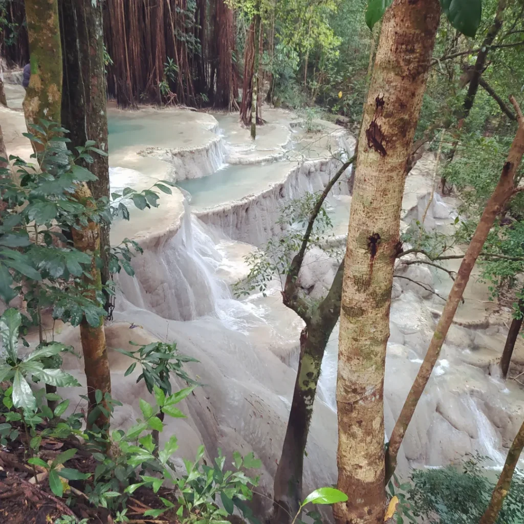 Muddy jungle trail leading down from the monster truck drop-off point to Kaparkan Falls in Tineg Abra