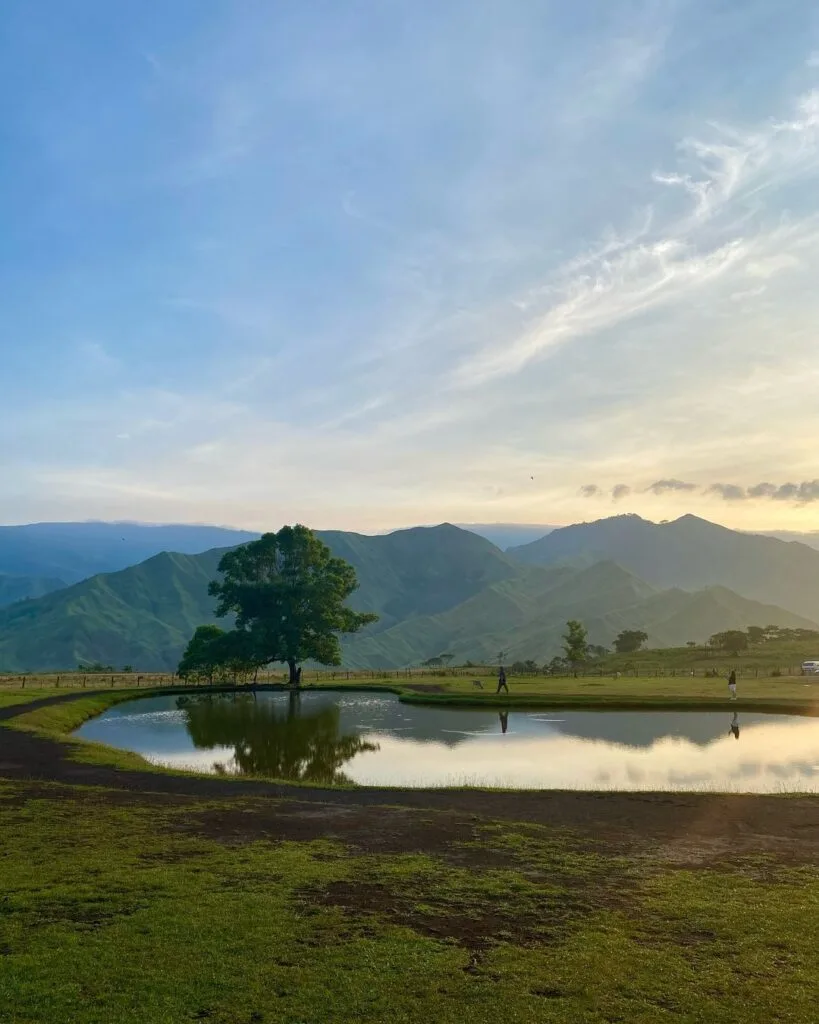 Panoramic view of Communal Ranch grasslands with Paminahawa and Kapayawan ridges in the background, Impasugong Bukidnon