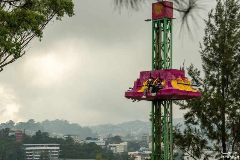 Skyranch Baguio entrance at SM City Baguio on Luneta Hill with pine trees and mountain backdrop