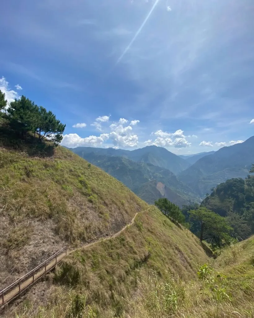 Steep concrete Stairway to Heaven trail on Mt. Kabunian with galvanized iron railings anchored into the cliffside