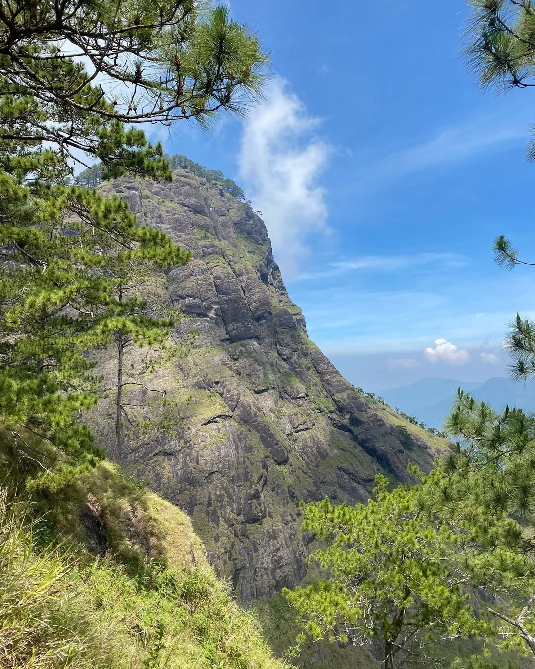 Mt. Kabunian summit marker at 1,789 MASL with panoramic views of Bakun, Benguet and distant Ilocos coastline