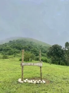Panoramic view from the summit of Mt. Lantik in Nasugbu, Batangas, showing surrounding mountain ranges and the Batangas coastline under a clear morning sky