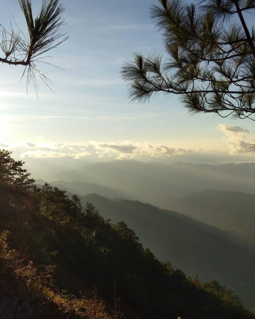Sea of clouds over the Cordillera mountain range seen from the Mt. Ulap summit grassland