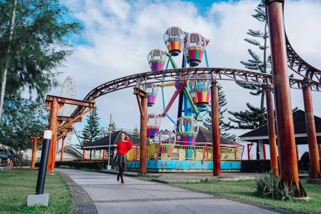 Loop Coaster roller coaster mid-ride at Skyranch Pampanga with riders screaming