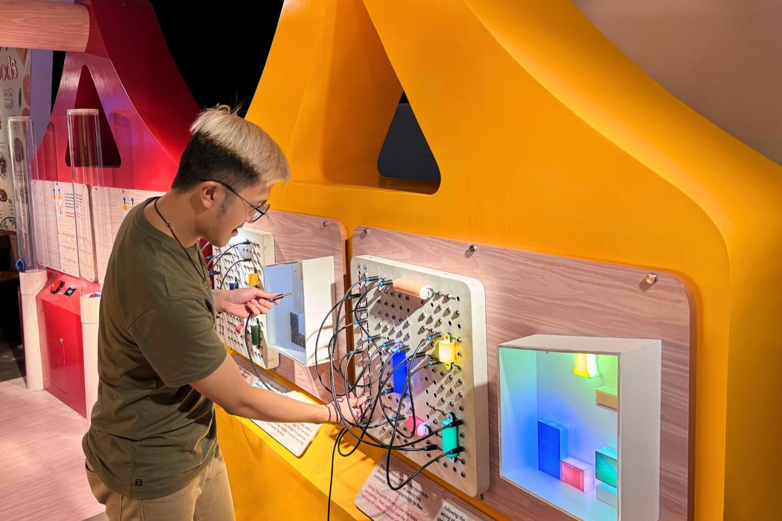 Families and children exploring interactive exhibits at The Mind Museum BGC