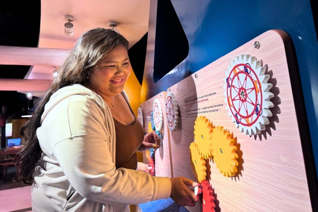 Families and children exploring interactive exhibits at The Mind Museum BGC
