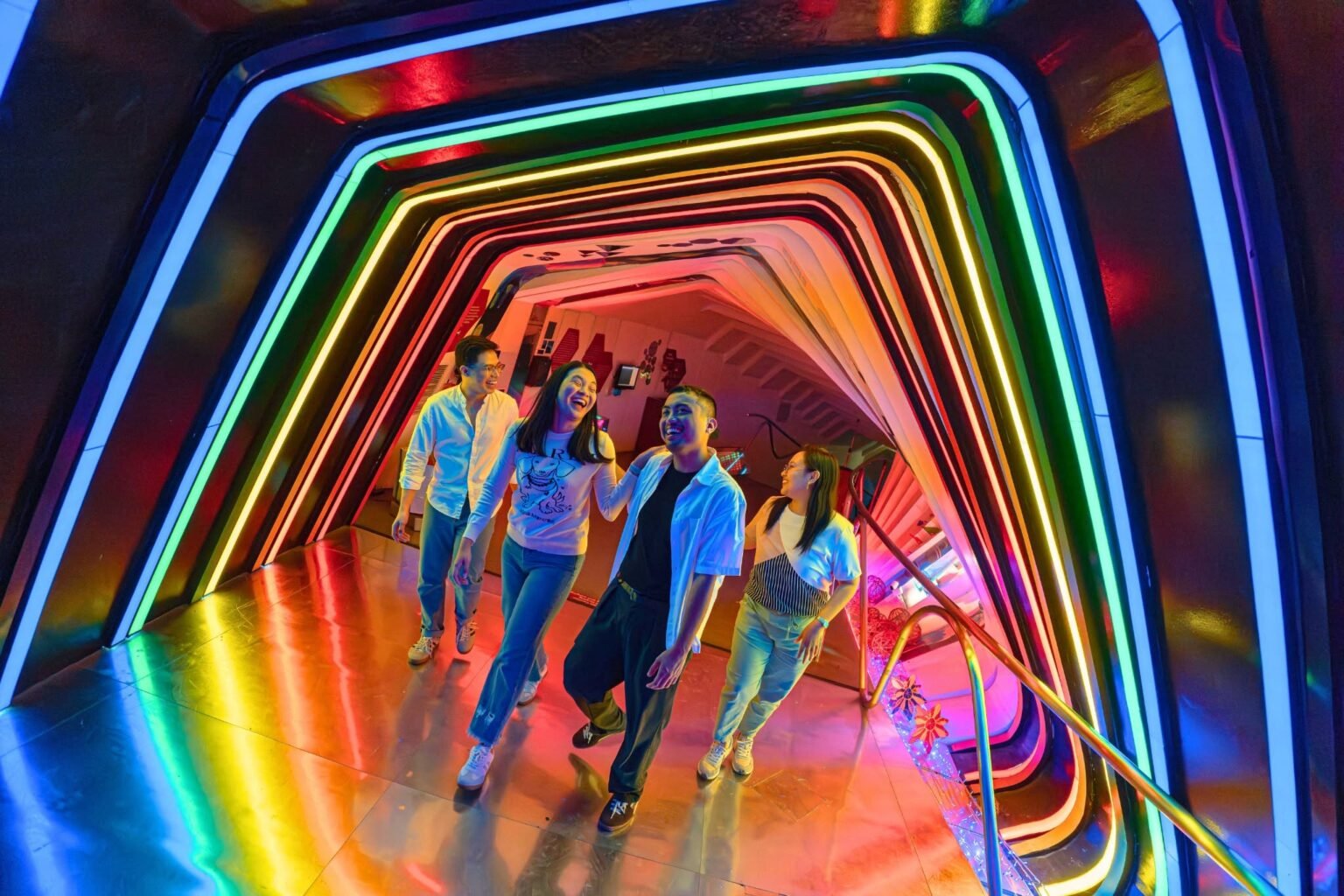 Families and children exploring interactive exhibits at The Mind Museum BGC