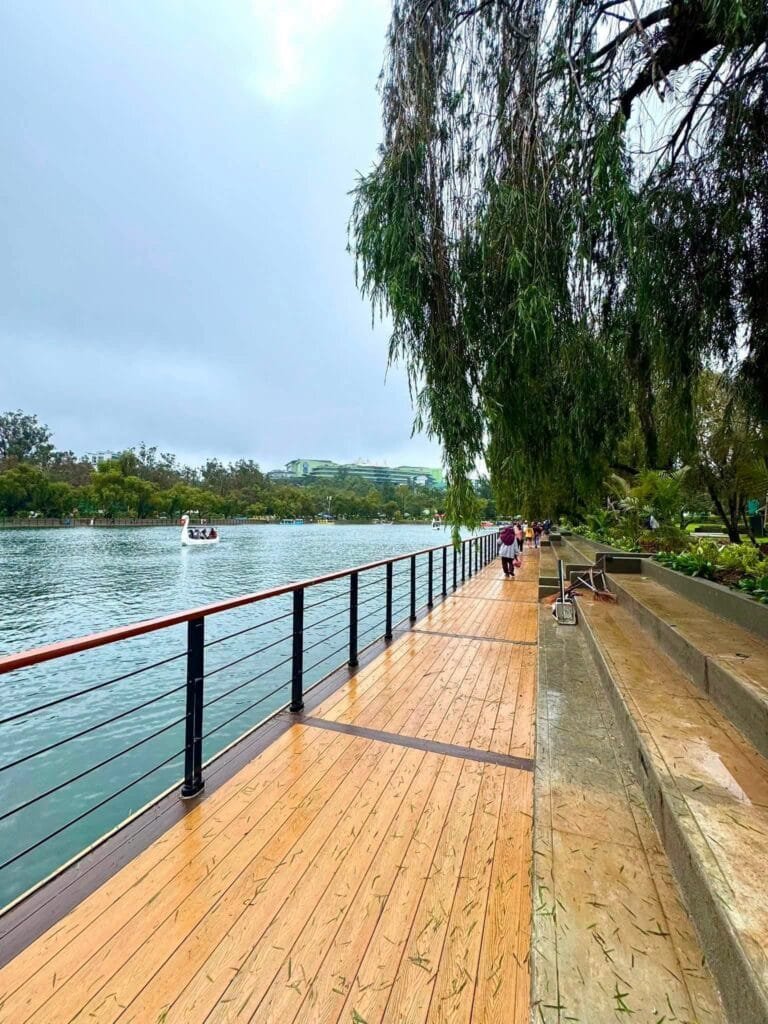 Burnham Park entrance and lakeside promenade with pine trees and open walkways in Baguio City